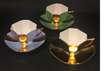 3 queen anne cups and saucers with goold panels
